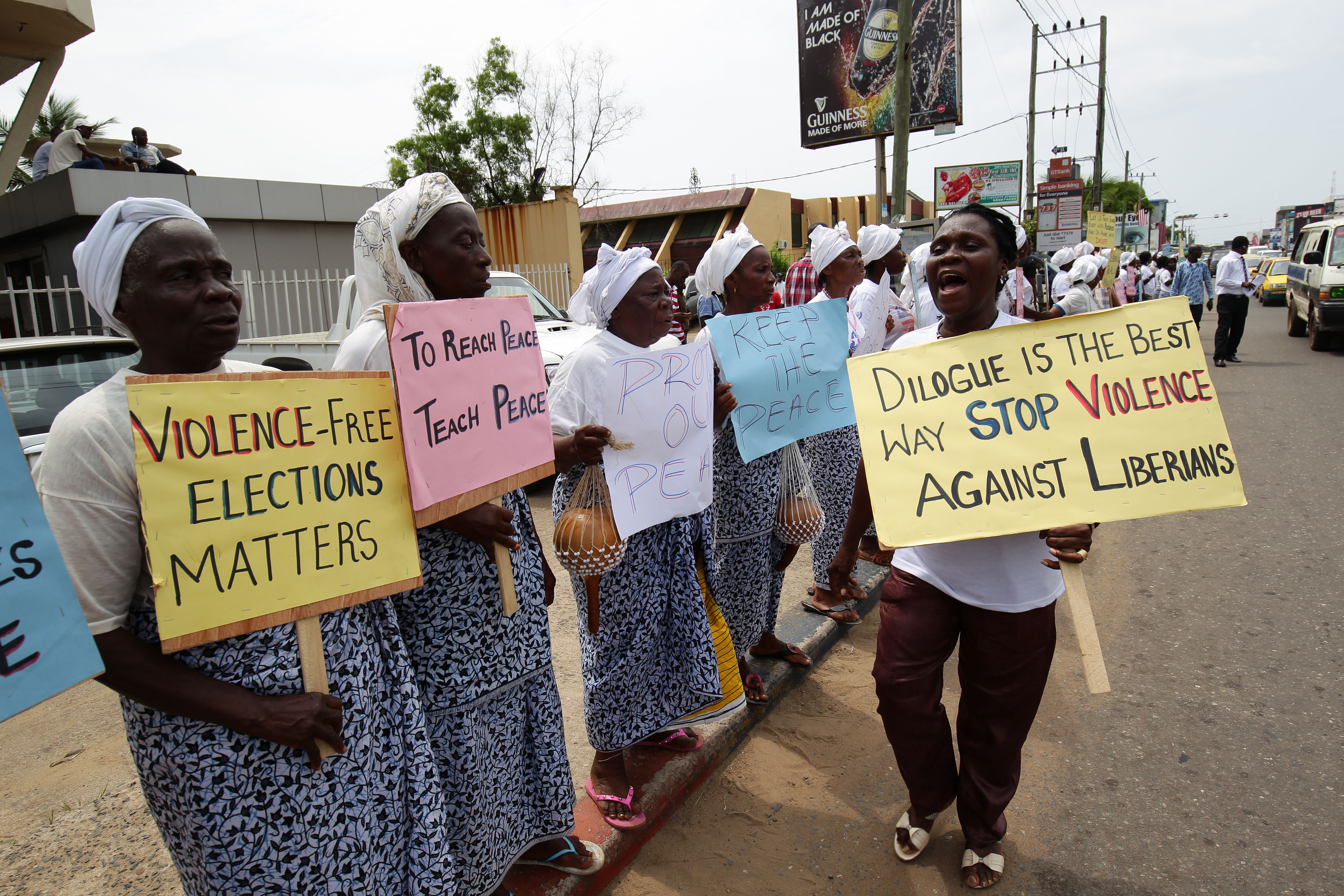 Liberian Women in peace Building Network(WIPNET) hold placards to protest for peaceful run-off presidential elections in Monrovia, Liberia,