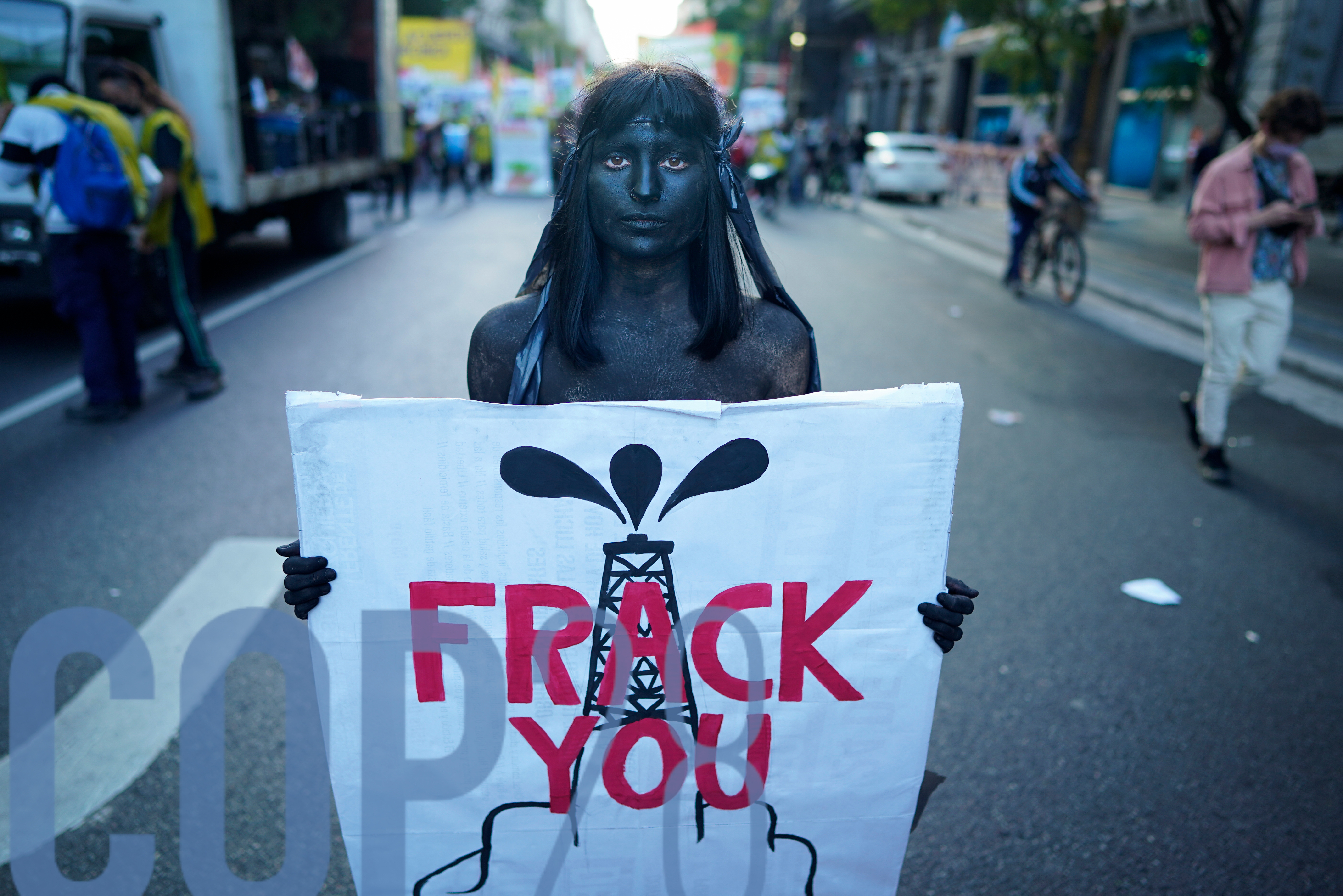 A demonstrator holds a sign against fracking during a demonstration of the global climate strike "Fridays for Future" in Buenos Aires, Argentina, Friday, 24 September 2021.