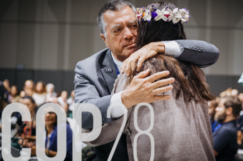 Delegation of the Marshall Islands hugging each other, taken during the final session in the plenary of COP28 in Dubai, 13 December 2023.