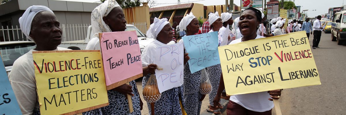 Liberian Women in peace Building Network(WIPNET) hold placards to protest for peaceful run-off presidential elections in Monrovia, Liberia,