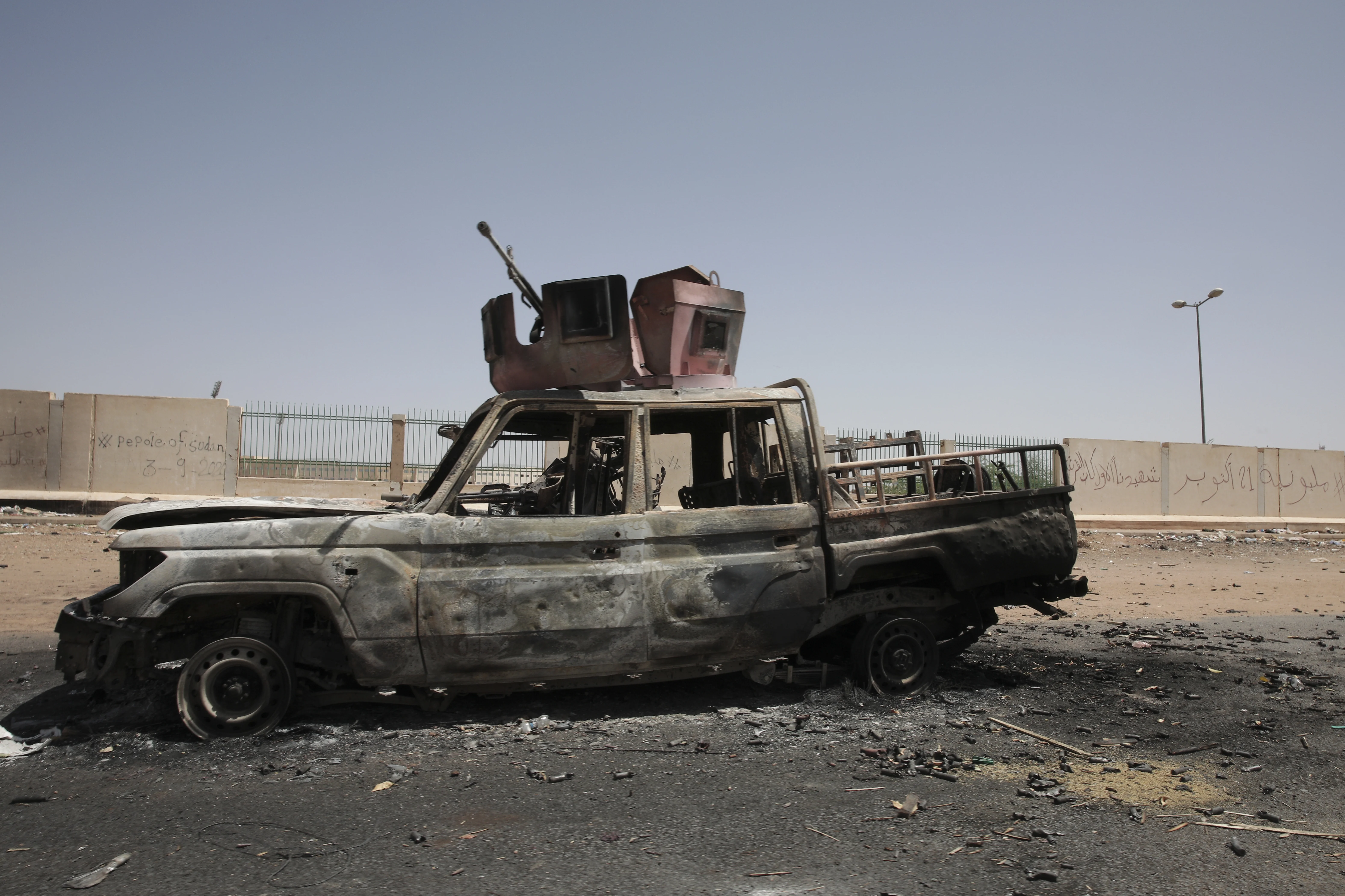 A destroyed military vehicle is seen in southern in Khartoum, Sudan, on April 20, 2023.