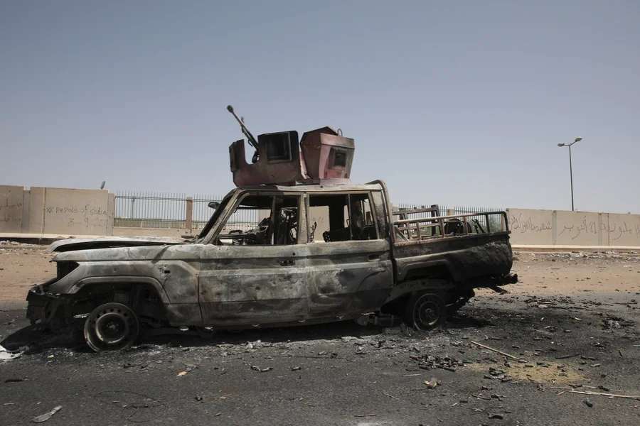 A destroyed military vehicle is seen in southern in Khartoum, Sudan, on April 20, 2023.
