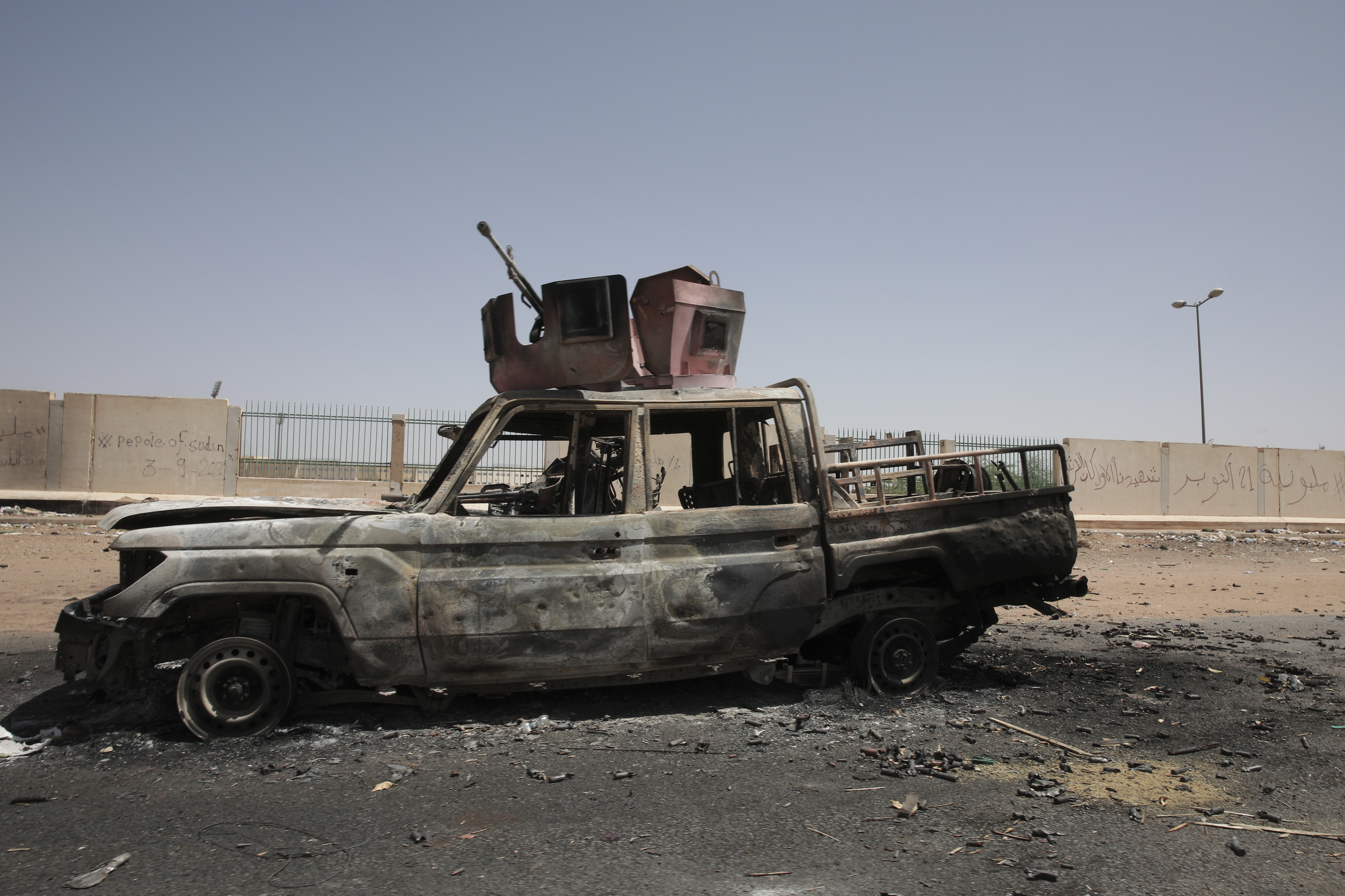 A destroyed military vehicle is seen in southern in Khartoum, Sudan, on April 20, 2023.