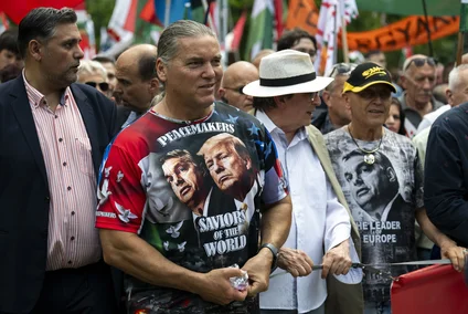 A man wearing a T-shirt showing Viktor Orban and Donald Trump, attends a "peace march" in support of Prime Minister Viktor Orbán and his party in Budapest.