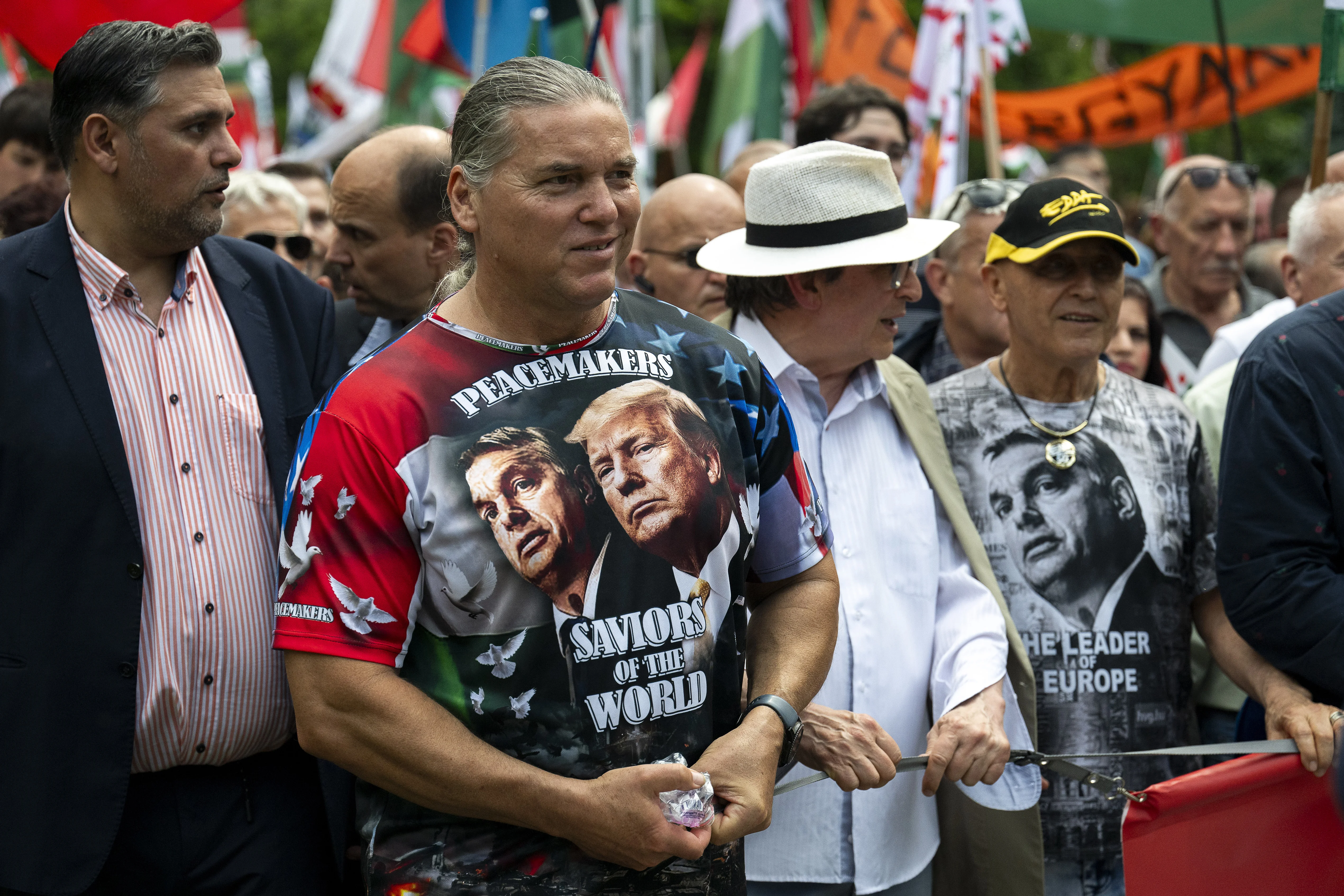 A man wearing a T-shirt showing Viktor Orban and Donald Trump, attends a "peace march" in support of Prime Minister Viktor Orbán and his party in Budapest.