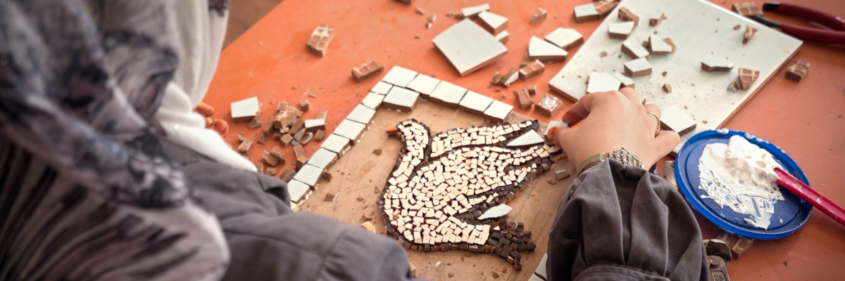 Woman crafting a white dove.