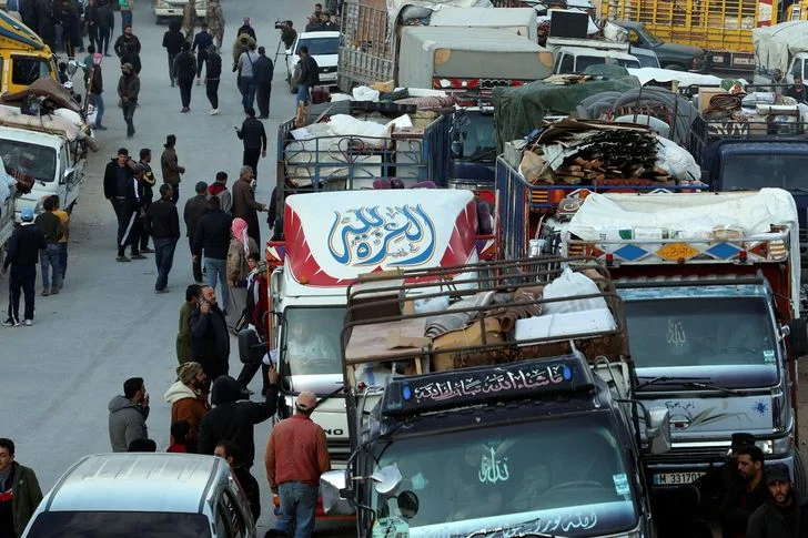 Syrian refugees prepare to return to Syria from Wadi Hmayyed on the outskirts of the Lebanese border town of Arsal.